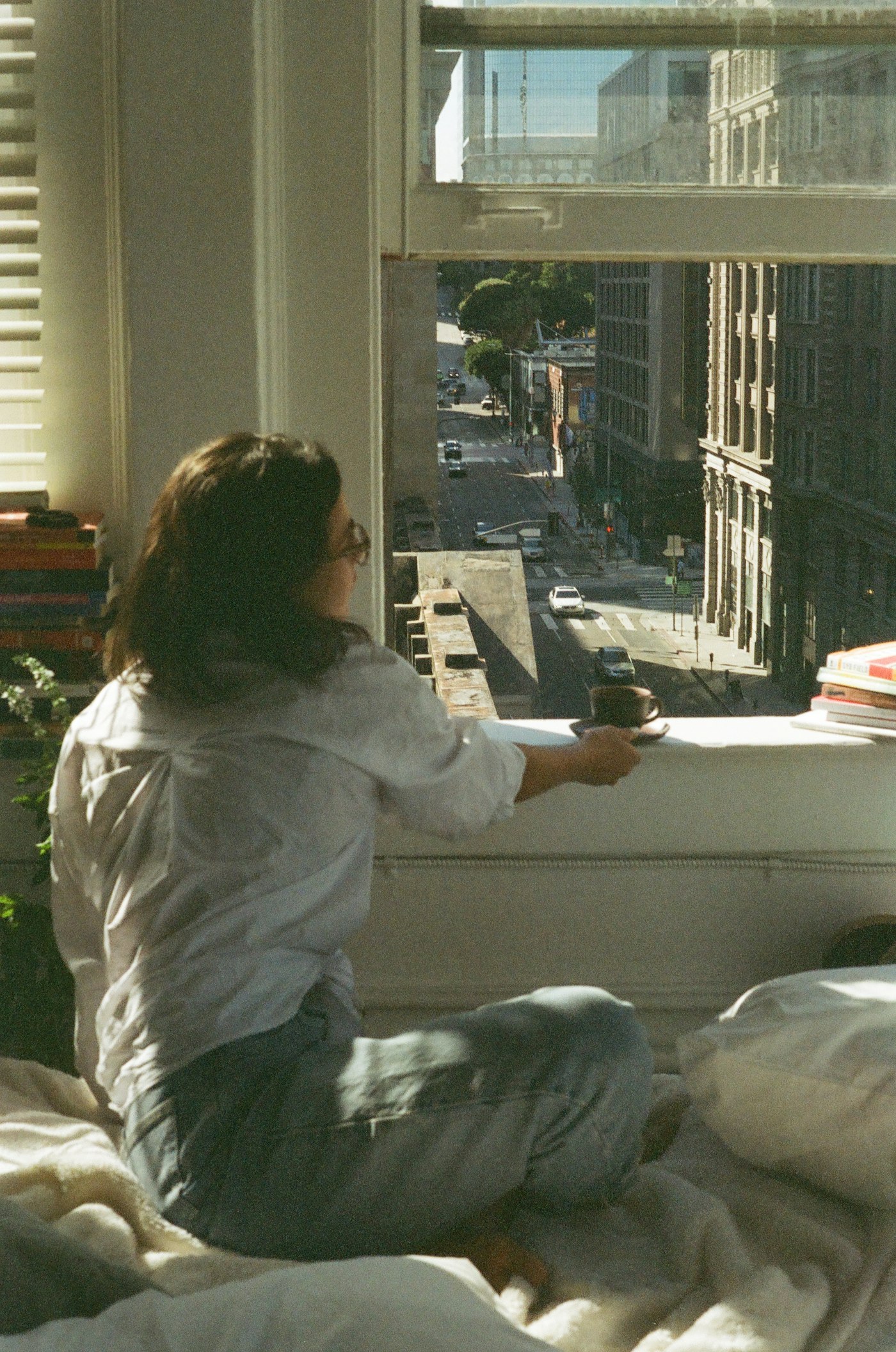 Viewer checking natural light by a window